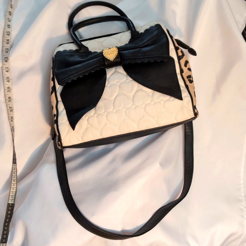 Betsey Johnson Black, White and Cheetah print at the sides.